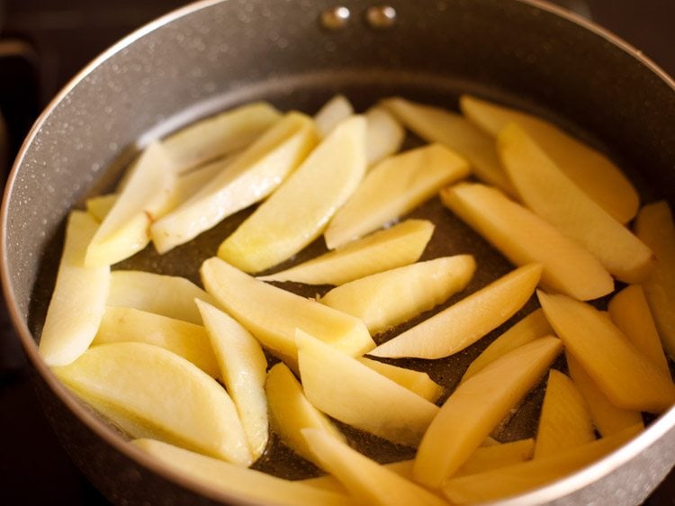 sliced potatoes in the pan