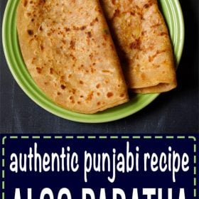 top shot of two folded aloo paratha on a green plate on black board with text layovers