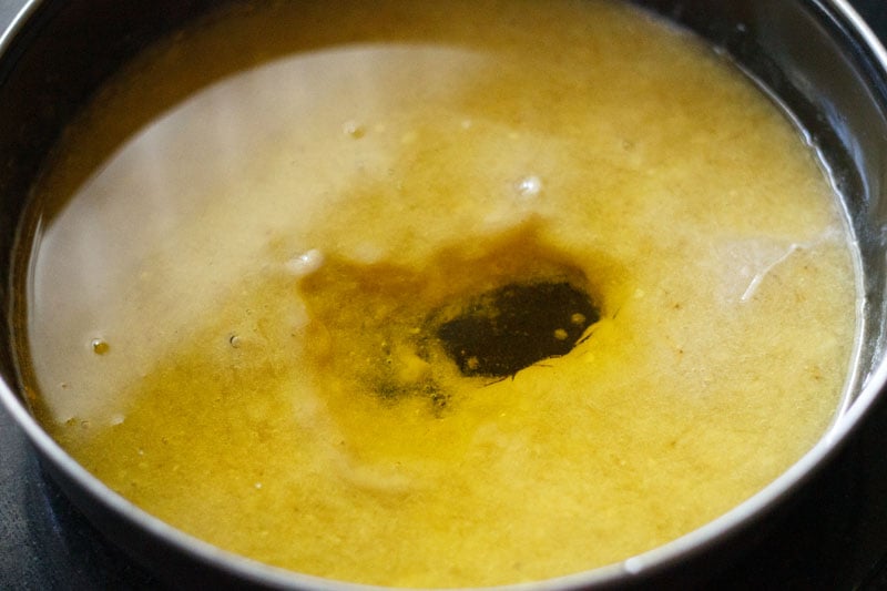 Top shot of puree with oil floating on top in bowl