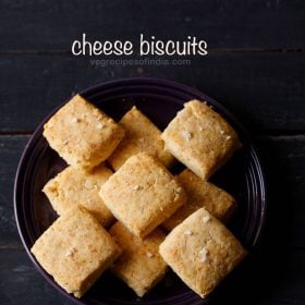 cheese biscuits served in a black bowl with text layover.