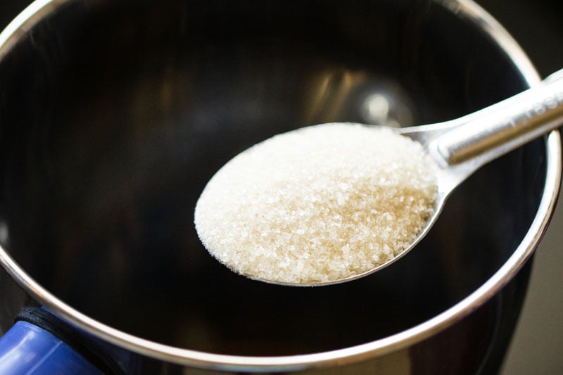 sugar being added to the blender