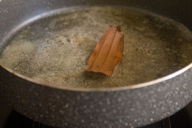 bay leaf cooking in butter in a large pot