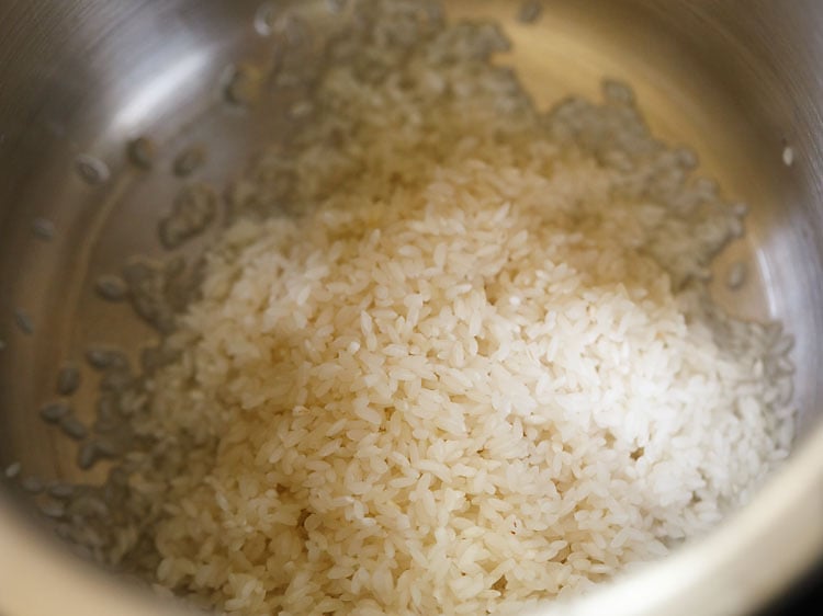 soaked rice added in a pressure cooker.