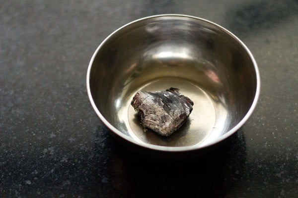 red hot charcoal kept in a small steel bowl