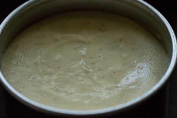baked new york cheesecake showing the edges are slightly dry looking and pulling away from the sides of. thepan