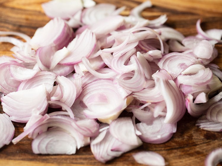 sliced onions on a chopping board