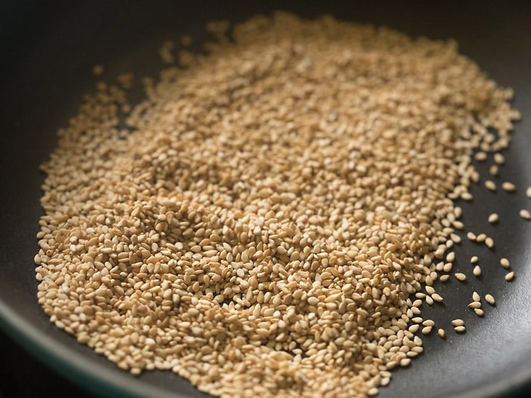 roasted white sesame seeds in a pan