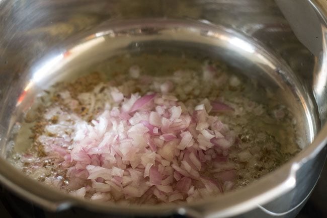 finely chopped onions added to cumin scented oil