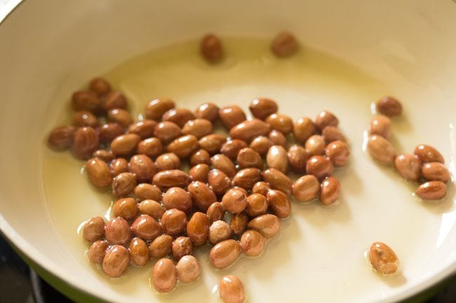 peanuts added in oil in a pan