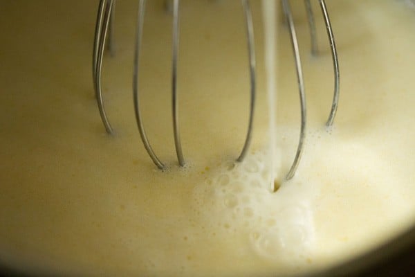 whisking in the milk for mac and cheese sauce. 