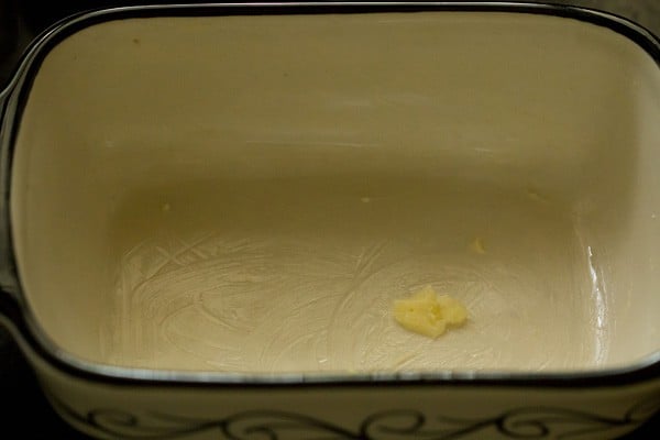 butter in an enamel casserole dish. 