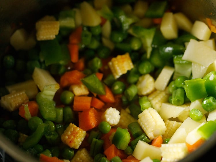Baby corn, carrots, green beans, potatoes, capsicum and green peas 