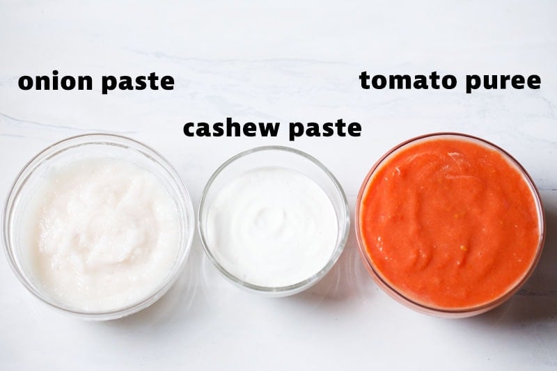 onion paste, cashew paste and tomato puree in glass jars