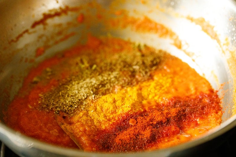 ground spices on the tomato puree