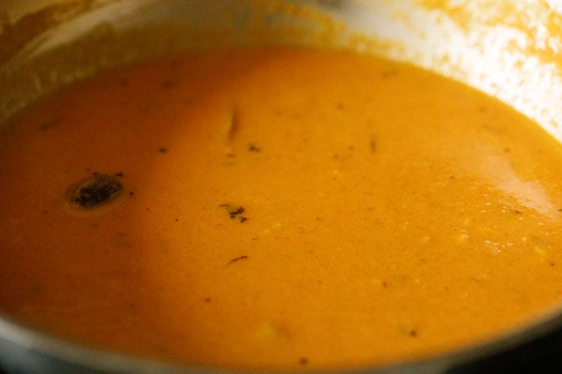 cream and dried fenugreek leaves mixed with the gravy