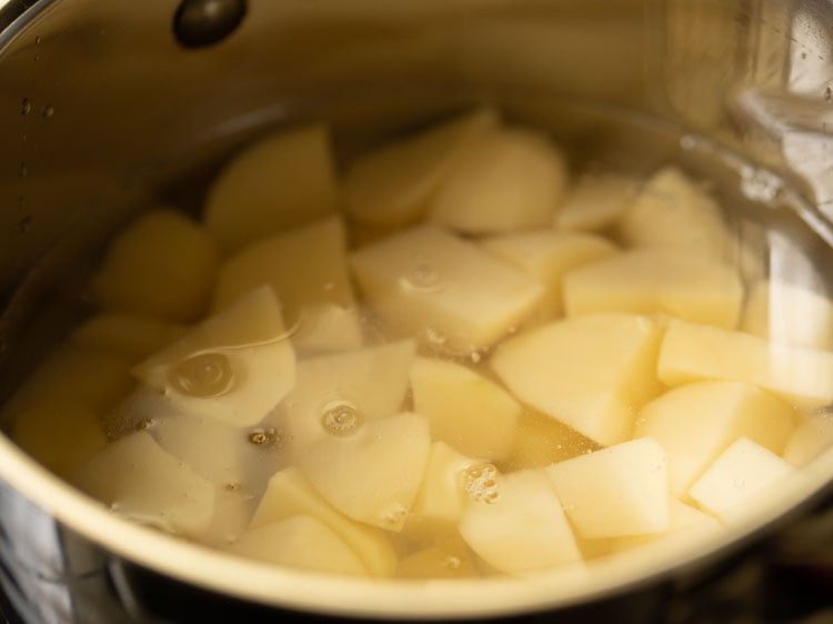 water added in the pan containing potatoes.