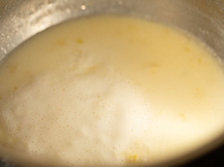 milk, butter and garlic mixture coming to a boil.