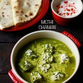 methi chaman served in a red casserole with a red plate of chapattis and a bowl of curd kept in the background and text layover.