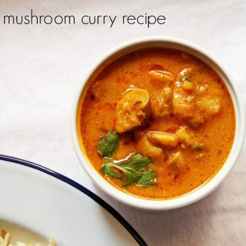 mushroom masala garnished with coriander sprigs in a white bowl on a white board