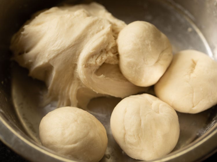 make dough balls from the kneaded dough