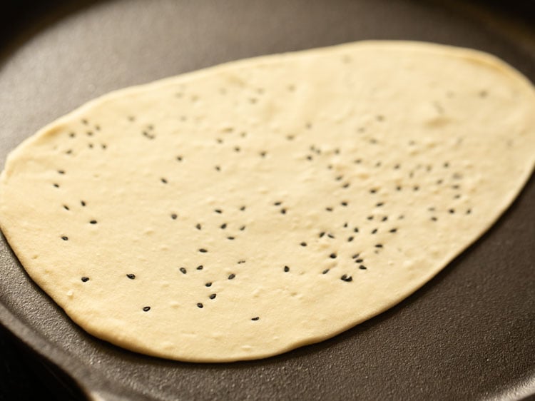 place rolled naan on hot griddle