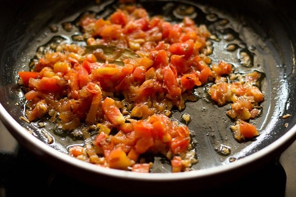 sautéing tomatoes to make palak paneer recipe
