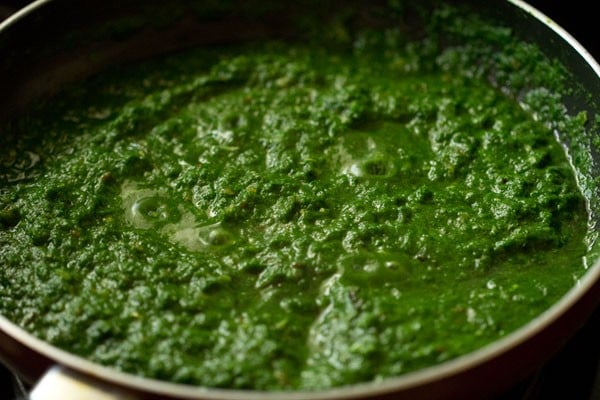 simmering the spinach sauce or gravy