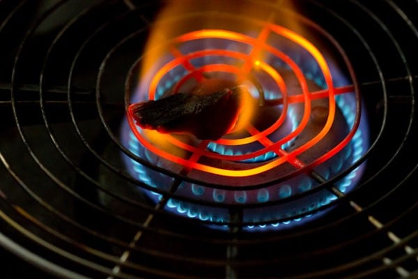 burning coal on burner flame