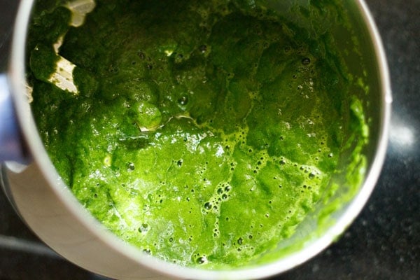 blended to a smooth spinach puree for making palak paneer recipe