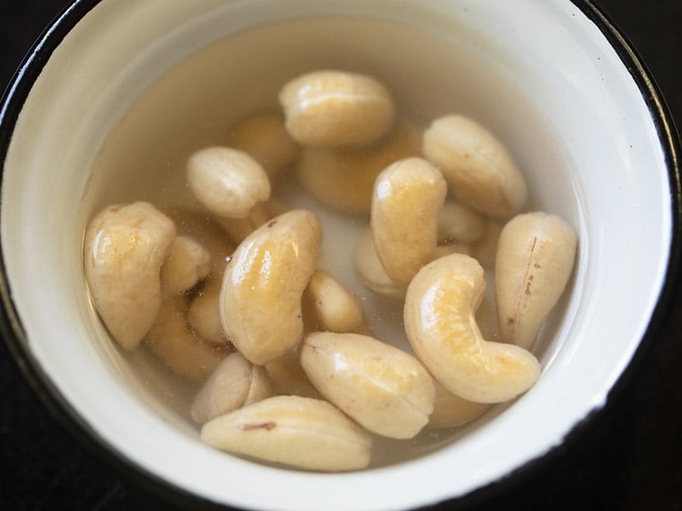 cashews getting soaked in hot water to make paneer butter masala gravy