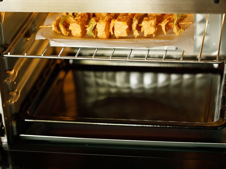 paneer skewers being grilled in the oven.