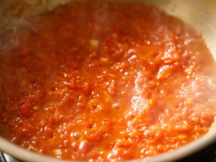 pizza sauce thickened and tomatoes have softened