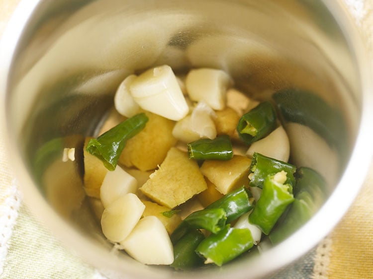 chopped ginger, garlic and green chillies in mortar-pestle.