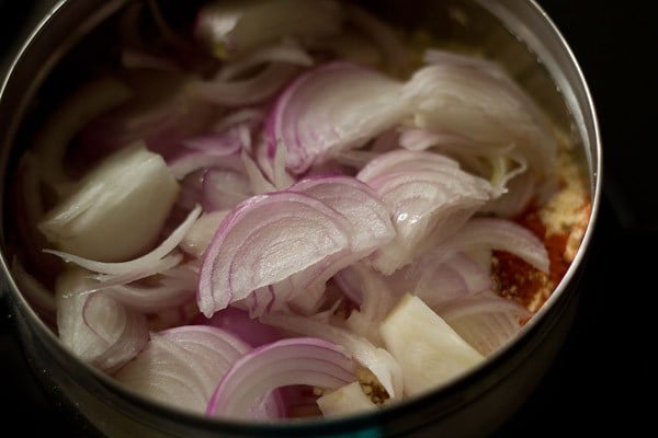 sliced onions added for kadhi pakora recipe