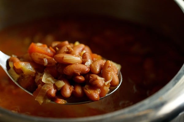 cooked rajma in a serving spoon