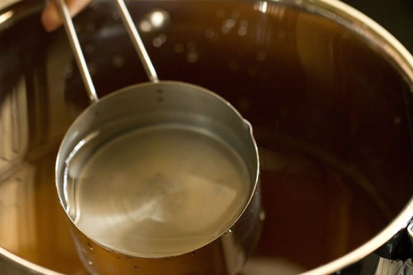 water added to sugar in pot