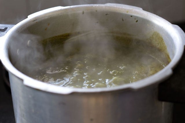 simmer the sarson ka saag while stirring occasionally.