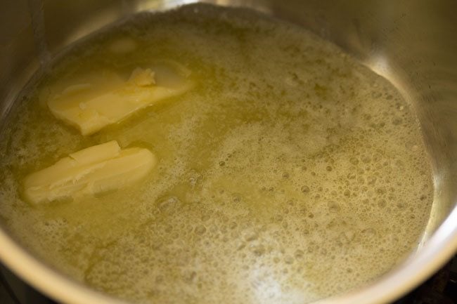 melting butter in a sauce pan for white sauce pasta recipe. 
